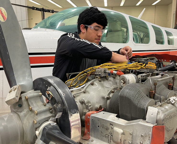 Featured State Tech Student Working On Airplane Mechanics