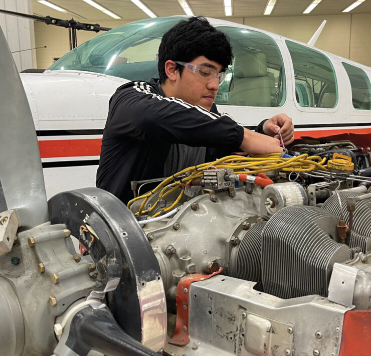 Featured State Tech Student Working On Airplane Mechanics