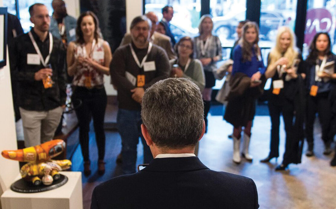 crowd gathered in a art studio for the Featured Unbound Book Festival Event