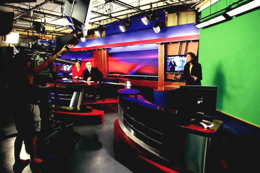 Duckworth gives Ray a cue during her weather report.