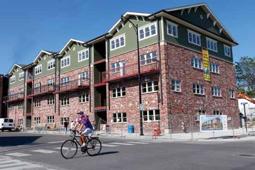 Workers scrambled during the week to finish the exterior of Brookside Downtown in time for college students to move in Saturday. The 16 four-bedroom units are all leased. The 32,000-square-foot building at the northeast corner of 10th and Locust streets is a Trittenbach Development project.