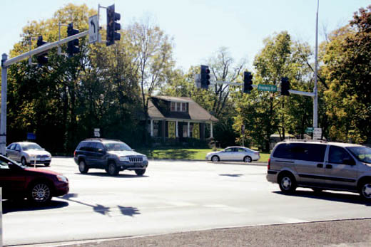 The house at the corner of Stadium Boulevard and West Broadway generally serves as a place for politicians to plant campaign signs. Neighbors on Bourne Avenue don’t like the rundown condition of the property but say the corner should stay residential and not be turned into an office building.