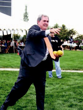 Wilson attempts to dunk his assistant in the dunk tank.