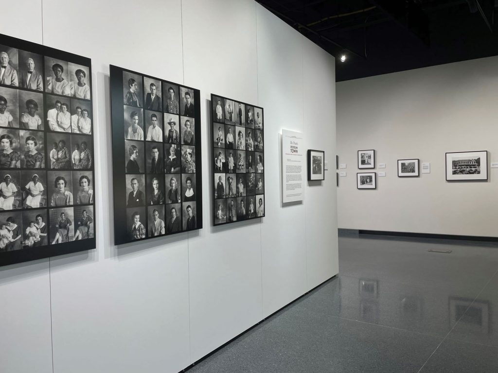 and smaller photos are on the right. The space is well-lit with a shiny gray floor.