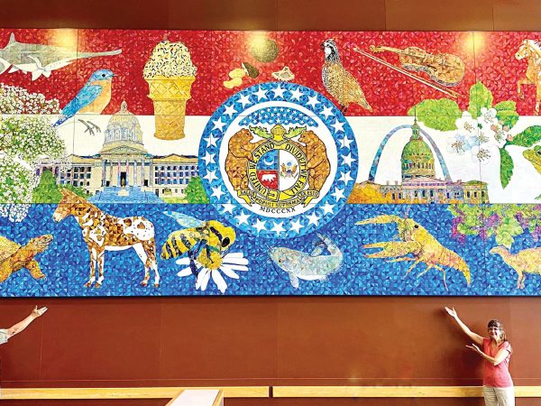 artists named Aaron Horrell and Barb Bailey by a large scale Missouri bicentennial mural