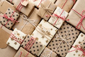 brown paper packages tied up with red and white string