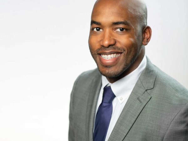Headshot of a man in a suit named David Seamon against a white wall