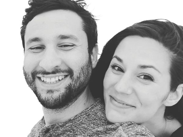 A black and white photo of a man and women