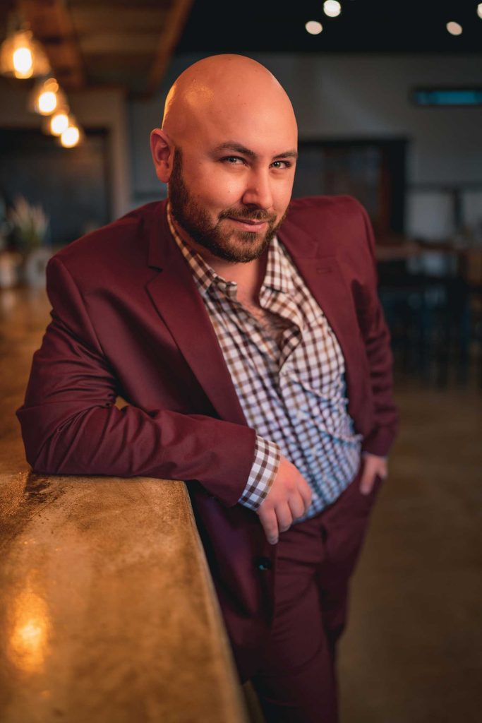 Headshot of a man named Brandom Banks standing and posing in front of the camera