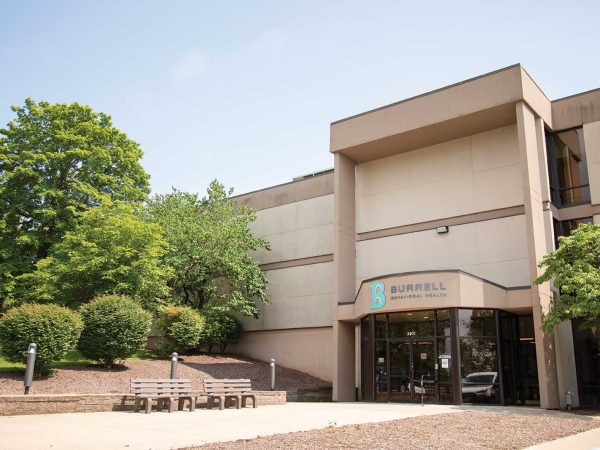 exterior of a large building with a sign that says "Burrell"