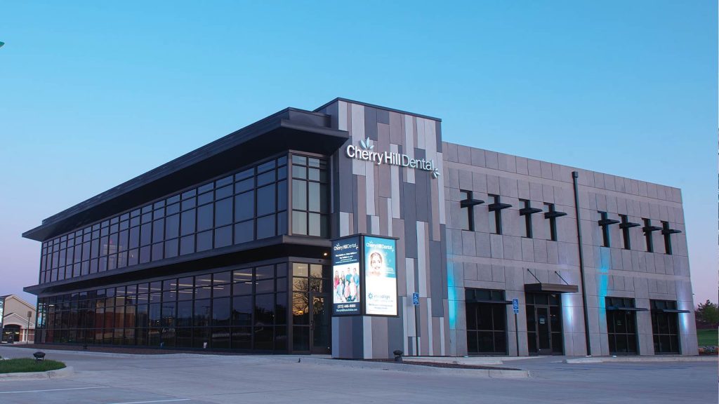 housing Cherry Hill Dental. The structure features large glass windows