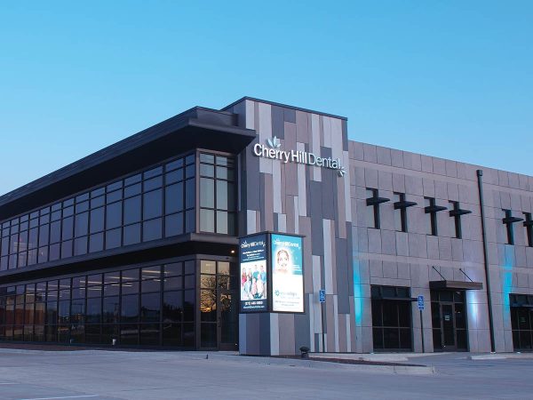 housing Cherry Hill Dental. The structure features large glass windows