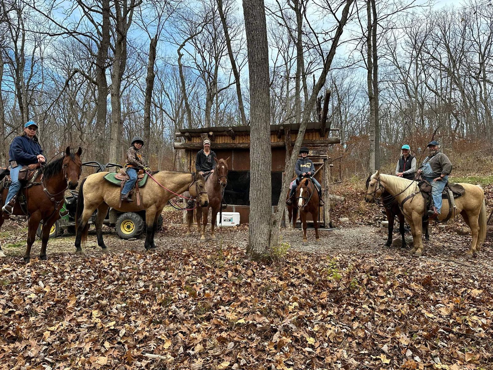 Coyote Hills trail riders at a shed in woods.