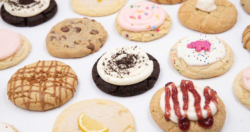 others are frosted with colorful sprinkles