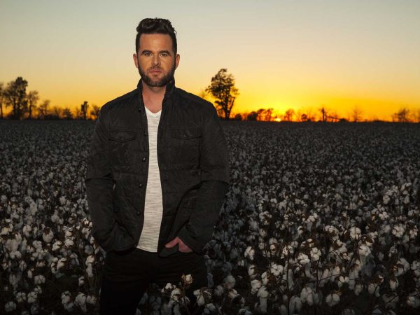 Headshot of David Nail at sunset in a cotton field