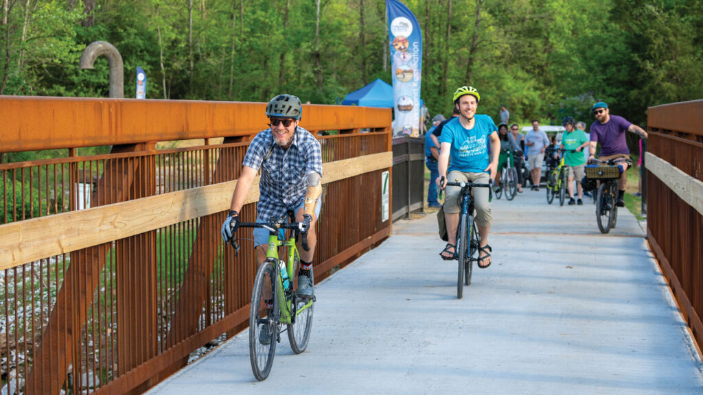 Featured Cyclists Enjoy The New Perche Creek Trail Bridge