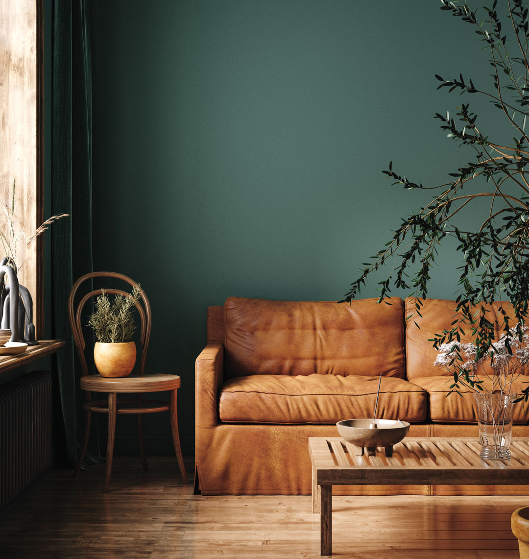 Green Wall Behind Camel Colored Couch