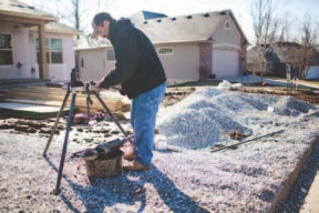 Bill Smith of TG Plumbing works at a house being built in the 6800 block of Chelan Drive.