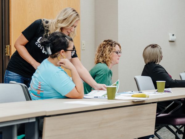 Instructor interacts with participants at Love Columbia financial class