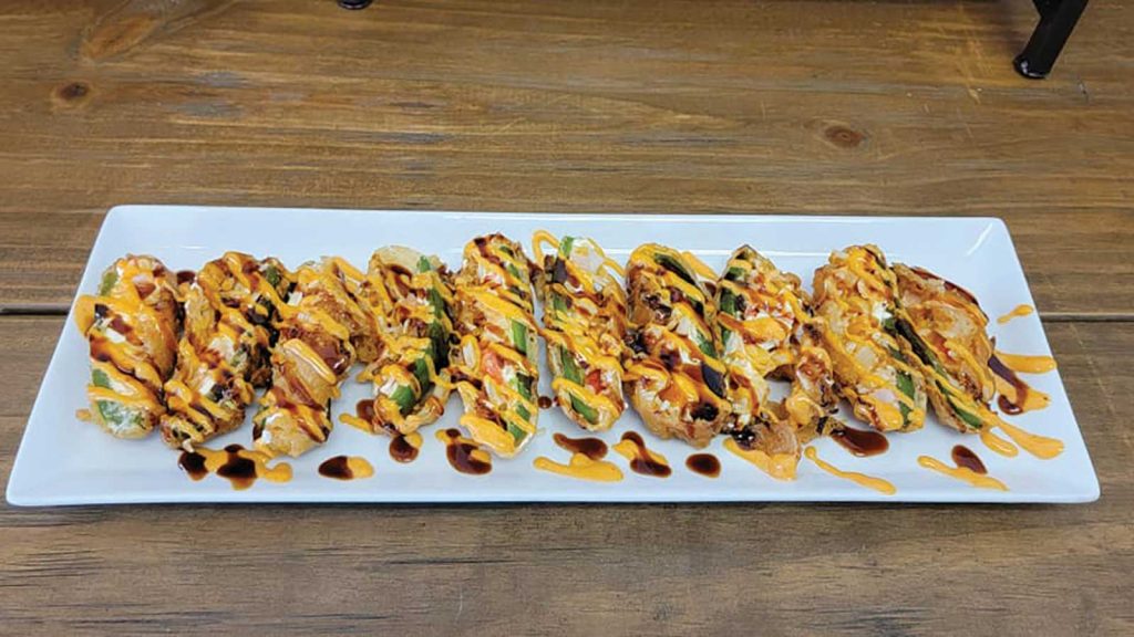 a food dish called kenko served on a long white platter