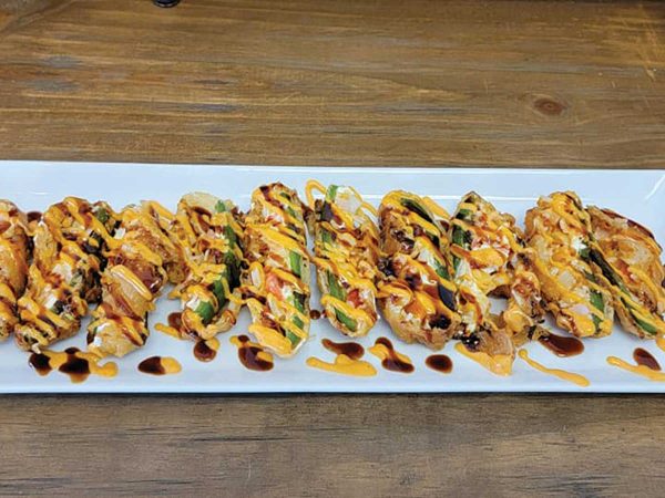 a food dish called kenko served on a long white platter
