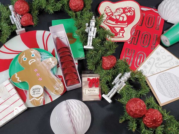 flat lay of Christmas holiday party supplies in green and red colors