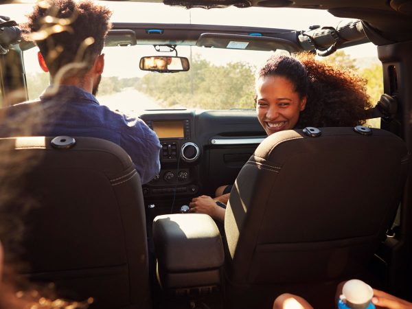 family of four in a car on a Roadtrip