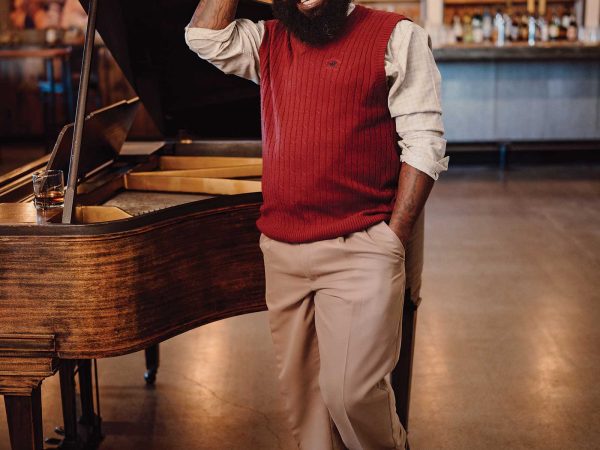 Headshot of man named Dr. Stephen Graves standing next to a piano