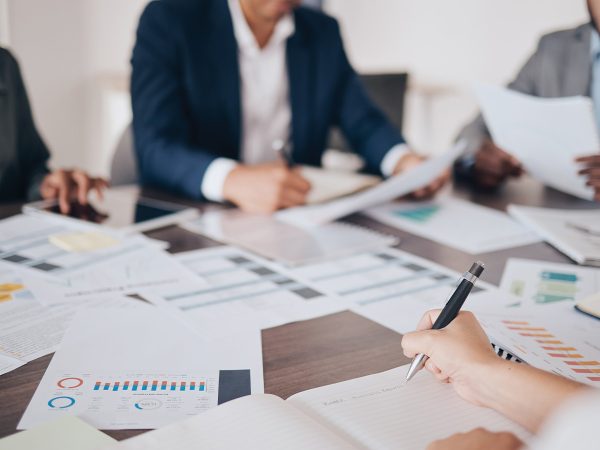 Stock photo of team going over annual budget