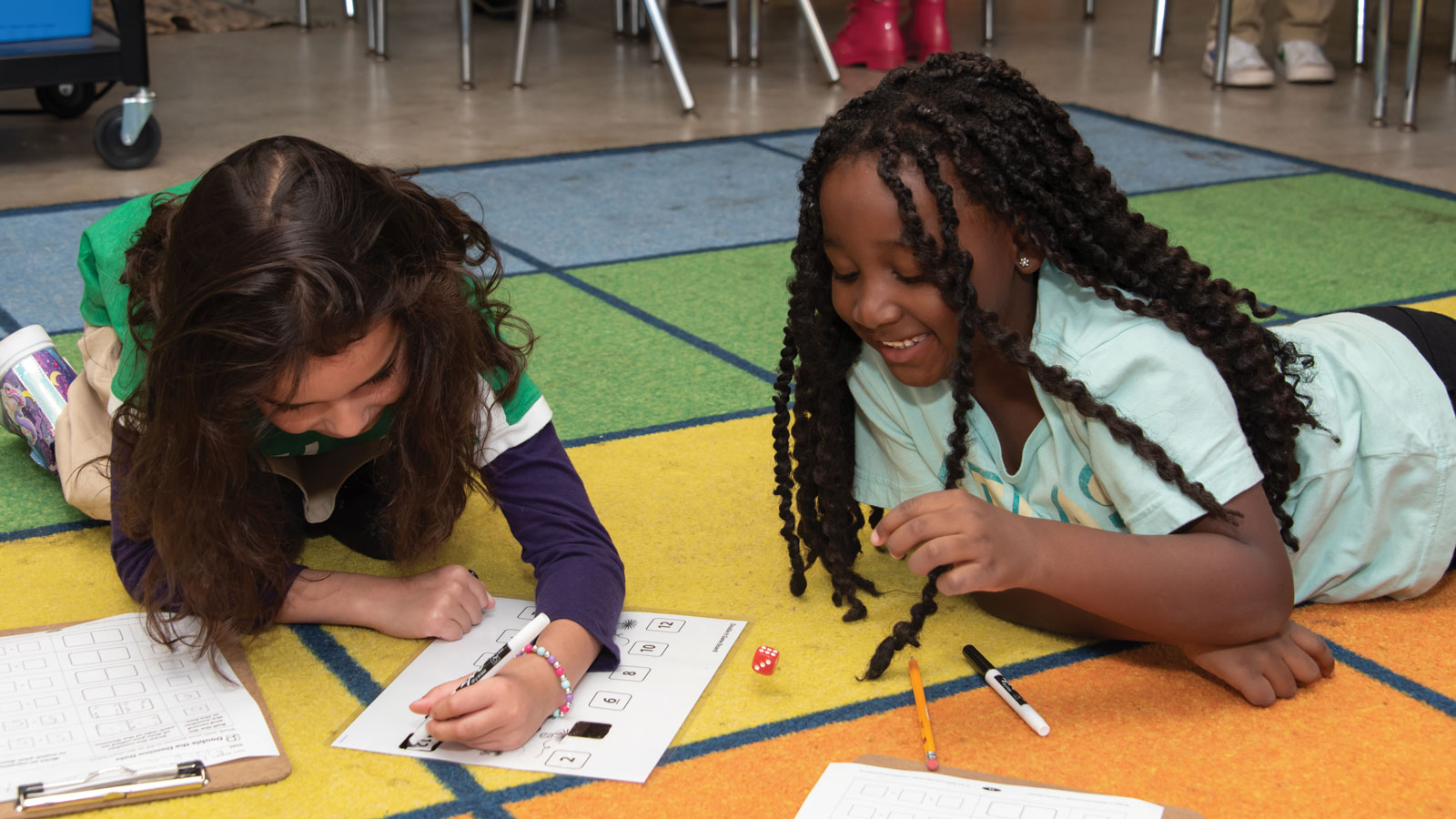 Students working on floor at Atlas Charter School