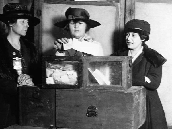 indicating an election or voting process. The scene reflects historical voting practices.