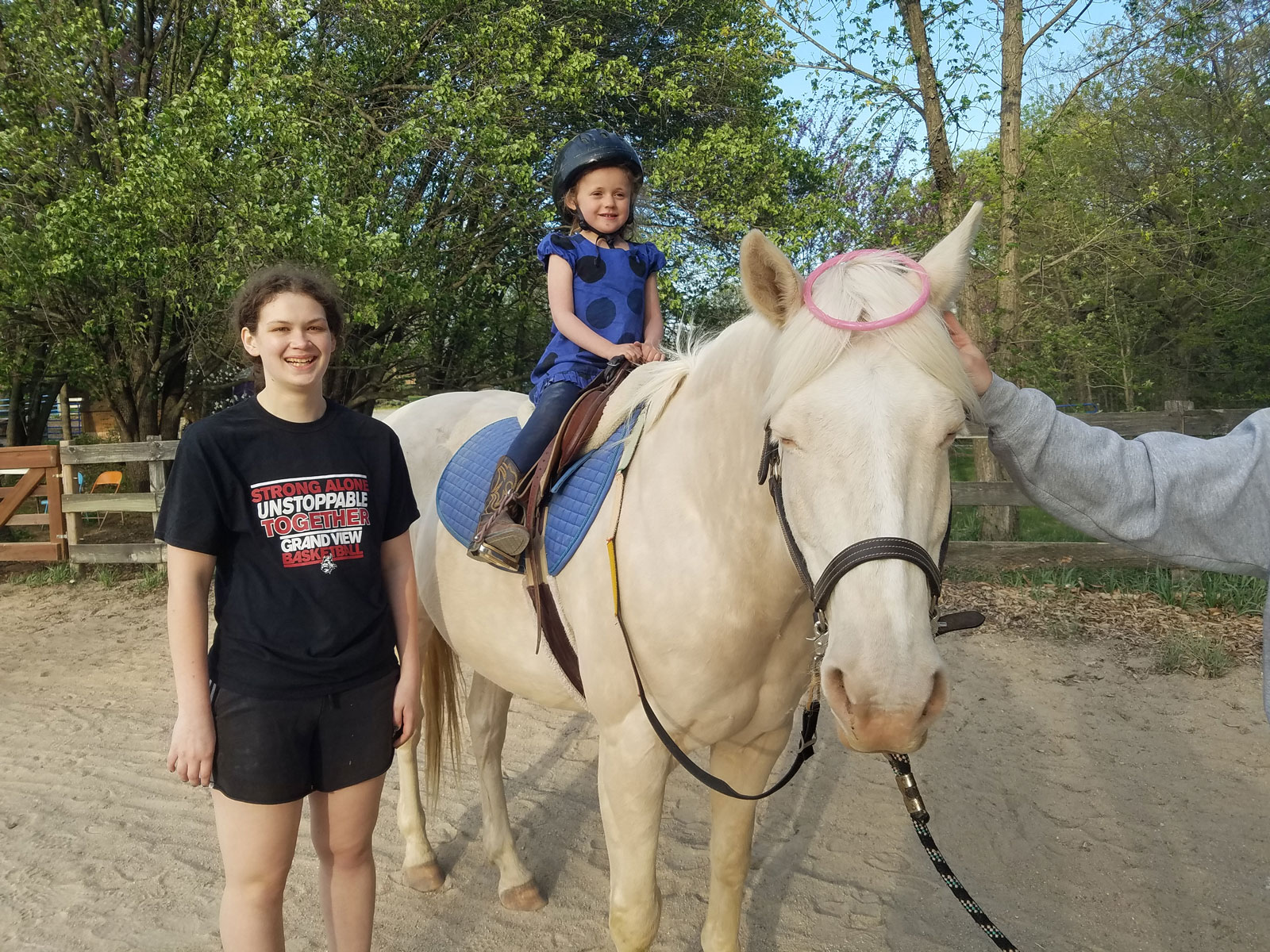 A young Sunny Oak rider on a white horse.