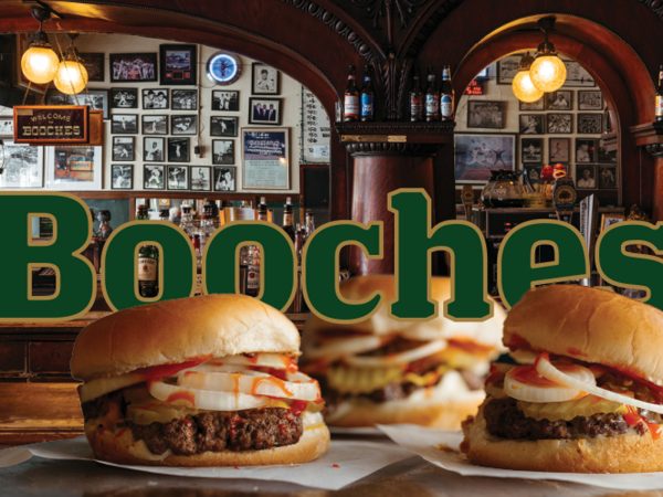 3-Booches-Burgers-Overlaying-the-word-Booches-in-green-text-outlined-in-gold-with-the-Bar-in-the-background