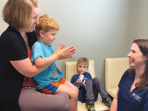 Alternate-Smiling-and-clapping-Mother-and-Child-with-Dr-Gruender00-copy