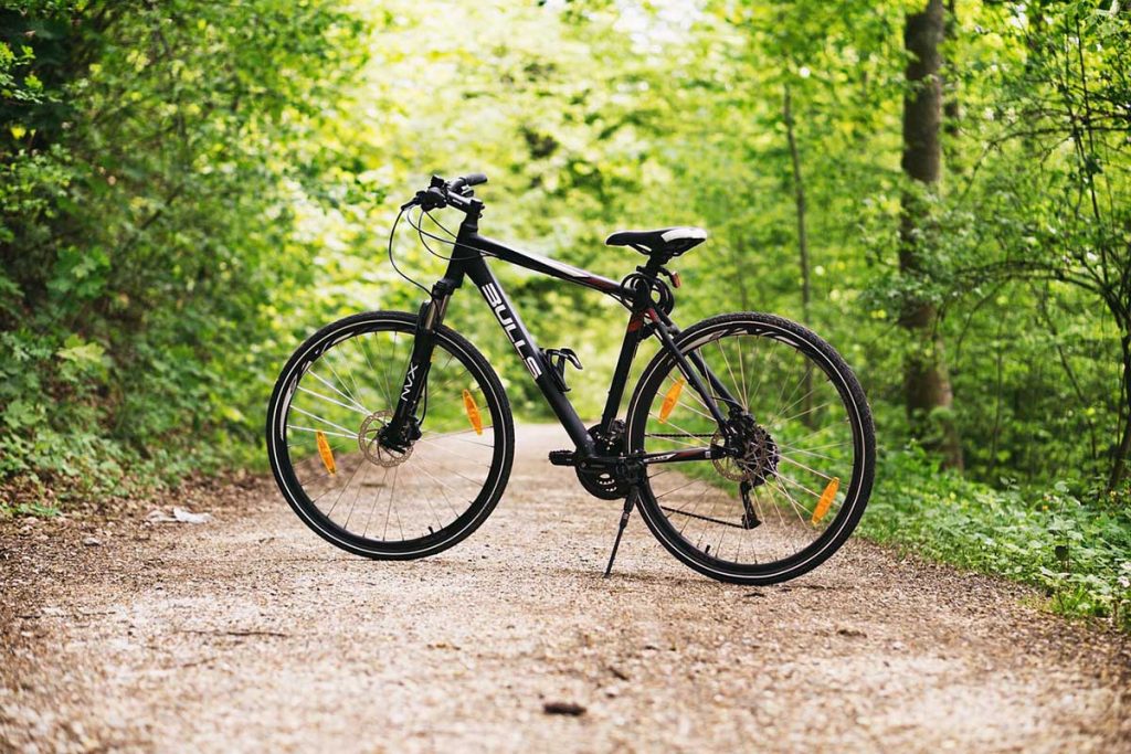 with a cycling helmet looped around the right handlebar