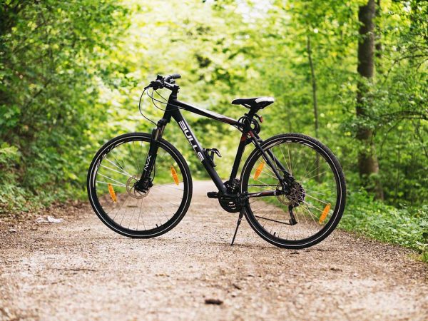 with a cycling helmet looped around the right handlebar