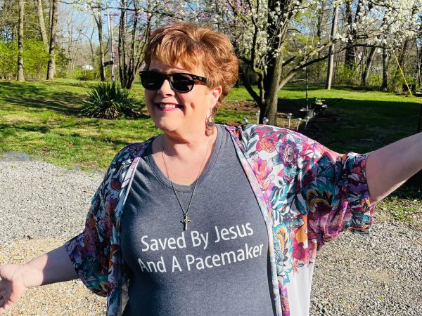 Cindy-Mutrux-in-a-shirt-that-says-Saved-by-Jesus-and-a-pacemaker