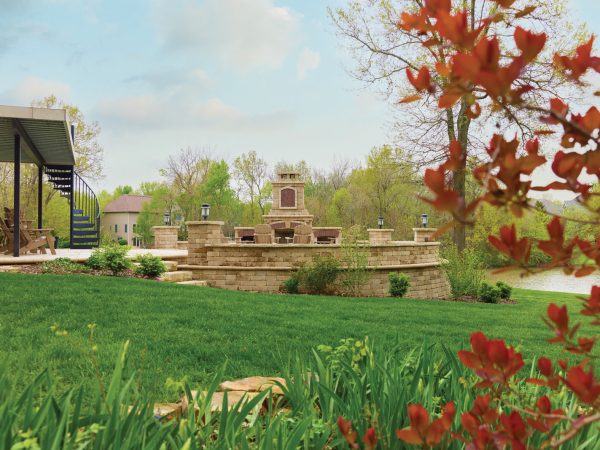 View-of-yard-and-patio-surrounding-outdoor-fireplace