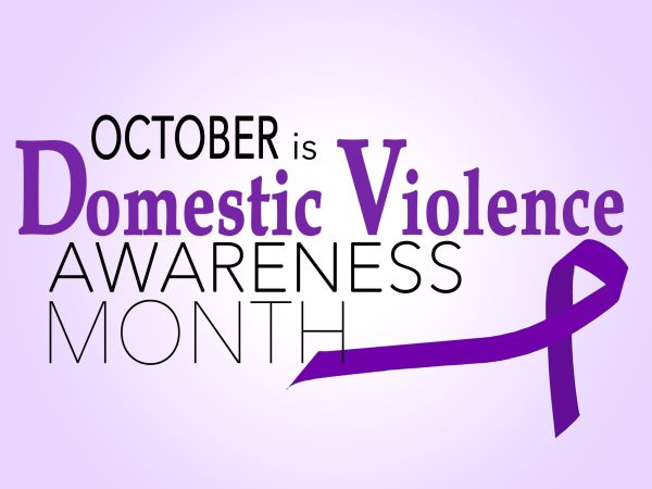 October is Domestic Violence Awareness Month with a purple ribbon symbolizing the cause. Supported by True North of Columbia