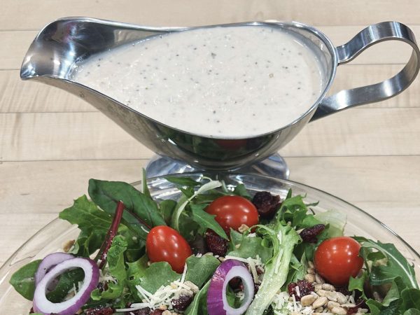 featured-a-sauciere-full-of-hoss-market-creamy-onion-dressing-next-to-a-bowl-of-market-harvest-salad