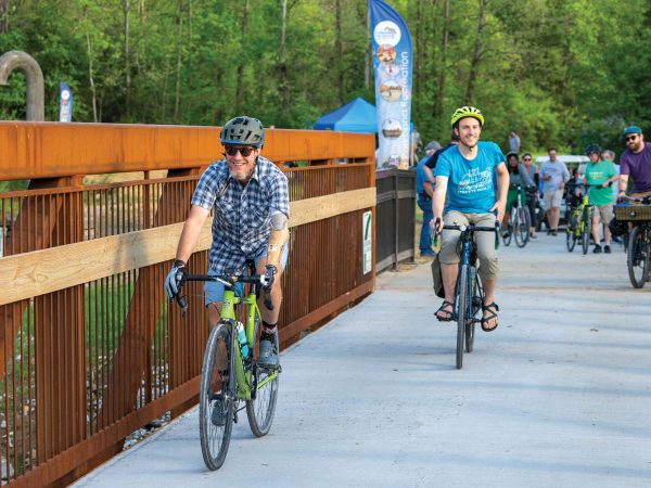 featured-cyclists-enjoy-the-new-perche-creek-trail-bridge