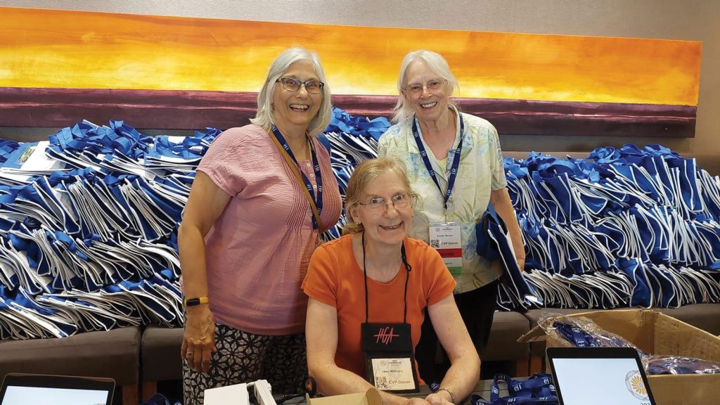 Susan Burpo stand while Jean Williams is seated.|Columbia Spinners Guild: Debbie Wilson|Columbia Spinners Guild