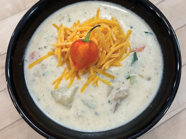 potato-habanero-chowder-in-a-black-bowl-on-a-wooden-counter
