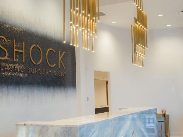 shock-plastic-surgery-front-desk-sign