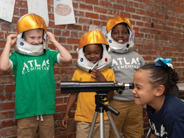 students-looking-through-telescope-Atlas-charter-school