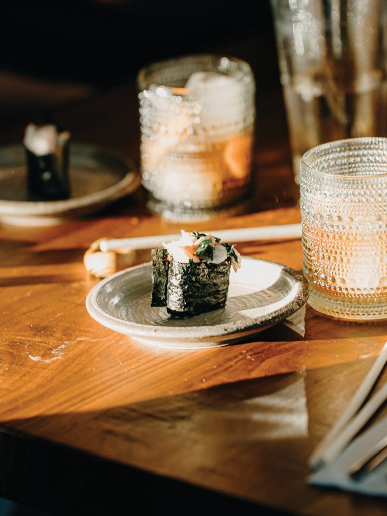 Table Setting At Ikigai Omakase Featuring Gunkan And A Cocktail
