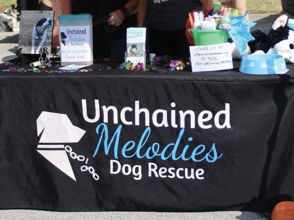 unchained-melodies-volunteer-booth-crop