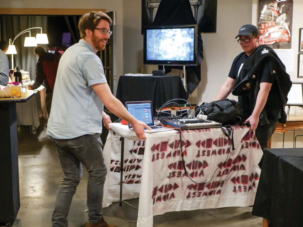 Vidwest Studio Members Setting Up Table