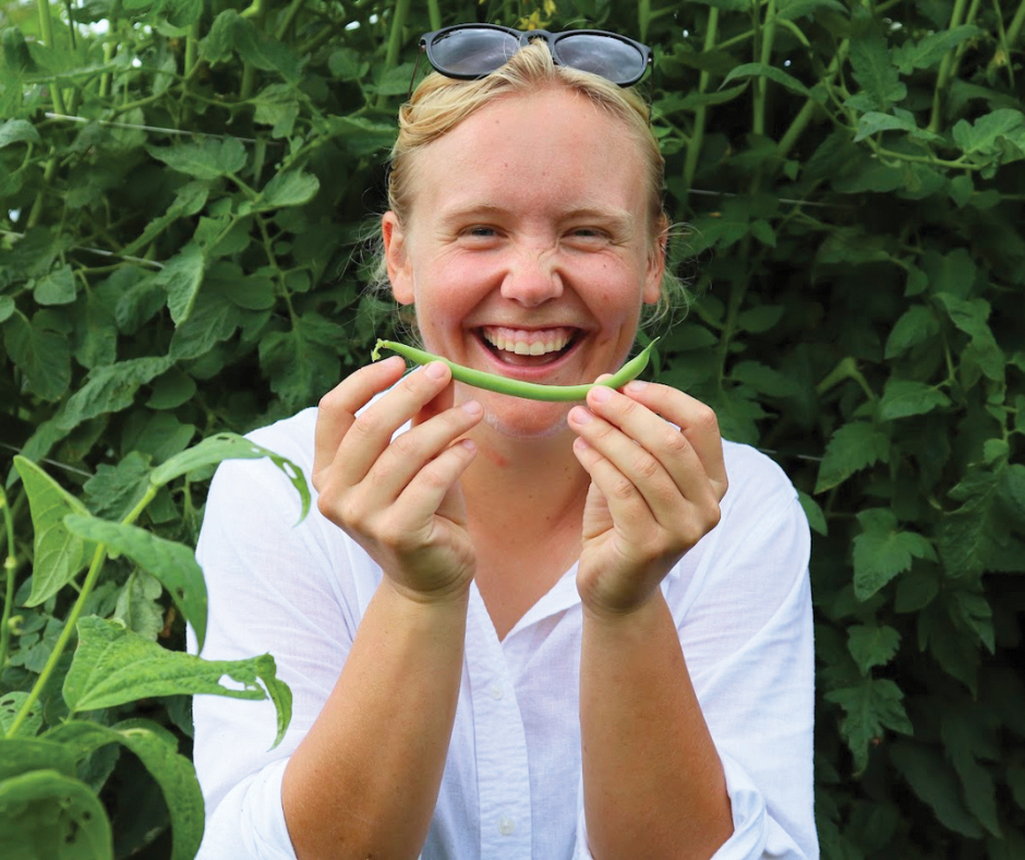 Woman Smiling With Green Bean Ccua