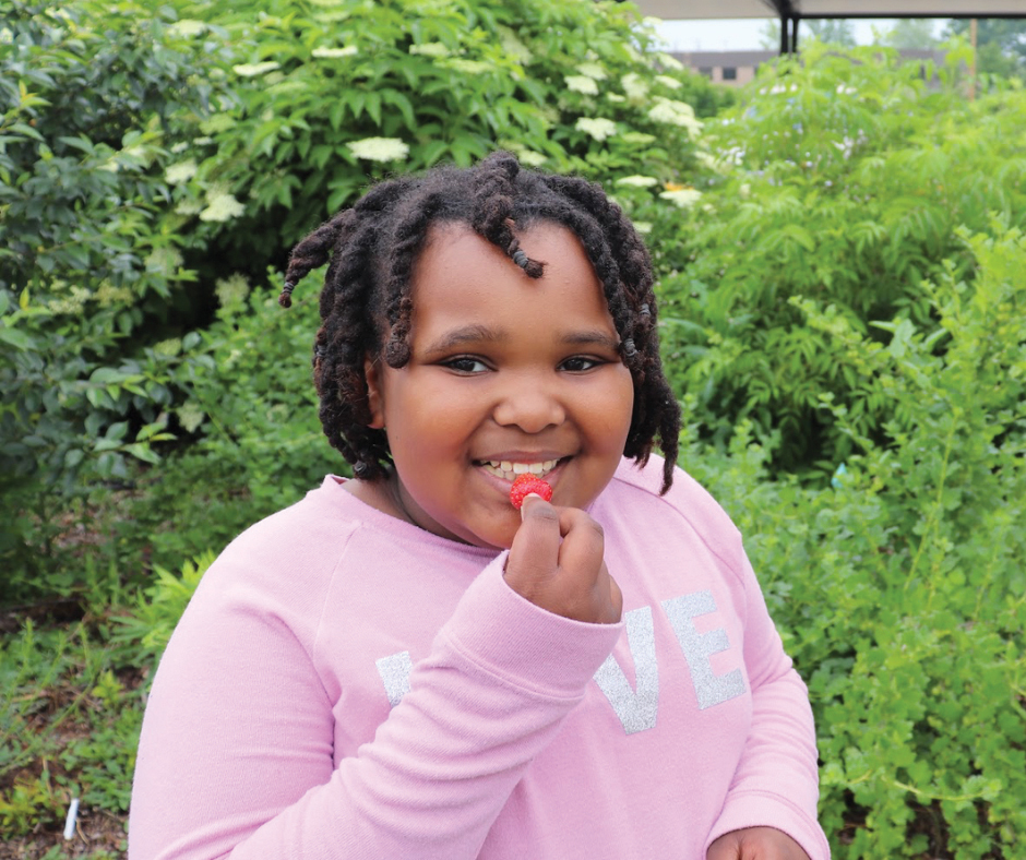 Young Girl Eating Freshly Picked Raspberry Ccua